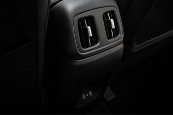 Dual Rear A/C Vents + Charging Ports